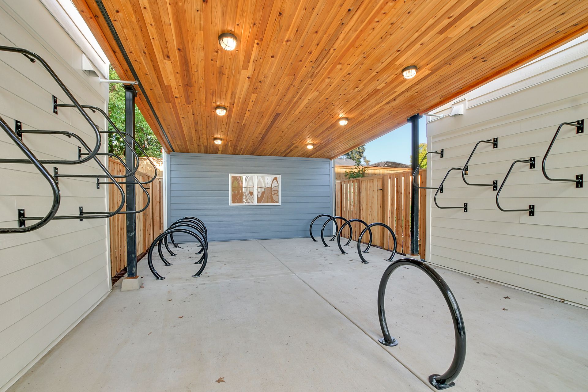Covered bike storage with floor and wall racks