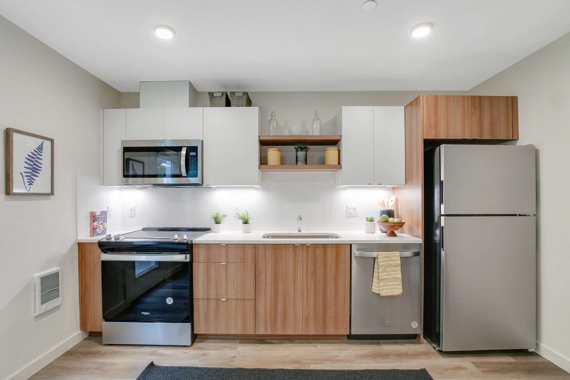Kitchen with quartz counters and stainless steel appliances